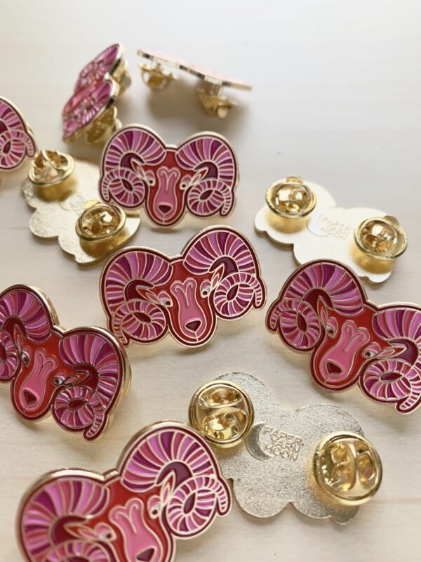 Aries Pin in red with gold enamel.