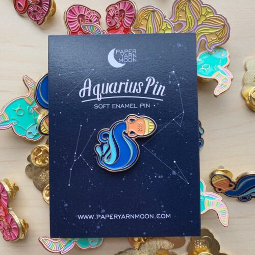 Aquarius pin featuring traditional symbol of water flowing out of a vase.