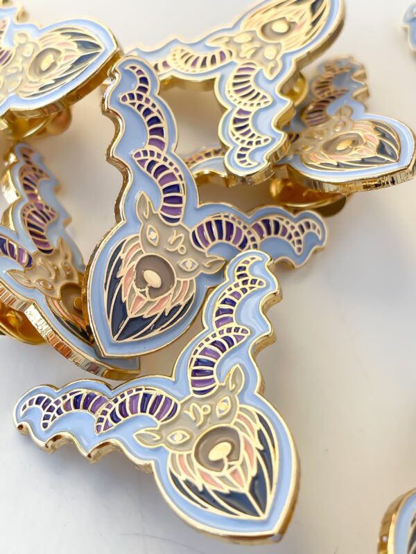 Capricorn pin, godl enamel in blue and purple horns.