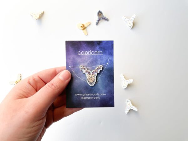 Capricorn pin by Astraluna arts with astrology symbol paper backing.