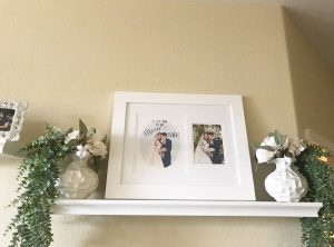 Custom wedding print of bride and groom on top shelf white frame.
