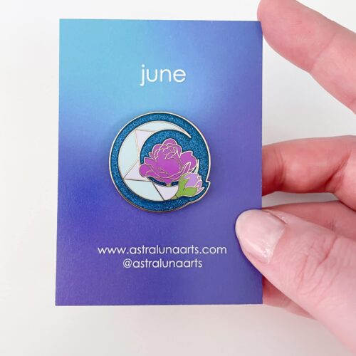 Moonstone and Rose birth pin with glittery blue backing on gold enamel. June month pin on light blue card ready to give.