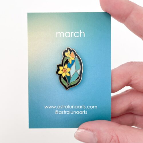 Aquamarine and Daffodils pin representing March birthstone.