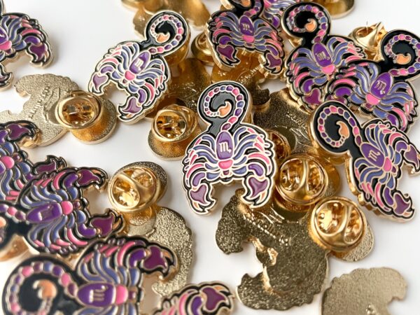 Scorpio pin with bright pink and purple with black. Gold enamel scorpio pins