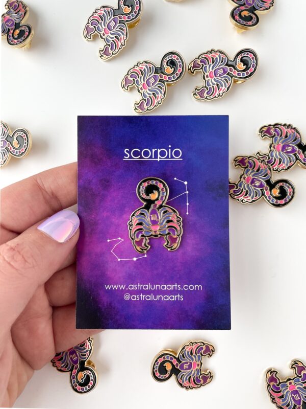 Scorpio pin with bright pink and purple with black. Gold enamel scorpio pin with astrology card backing.