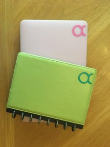 Taurus stickers for notebook on green notebook and pink laptop