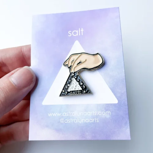 Salt pin on lavender card backing.