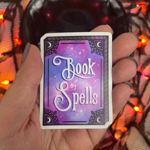 Book of Spells on book shaped sticker by Astra Luna Arts